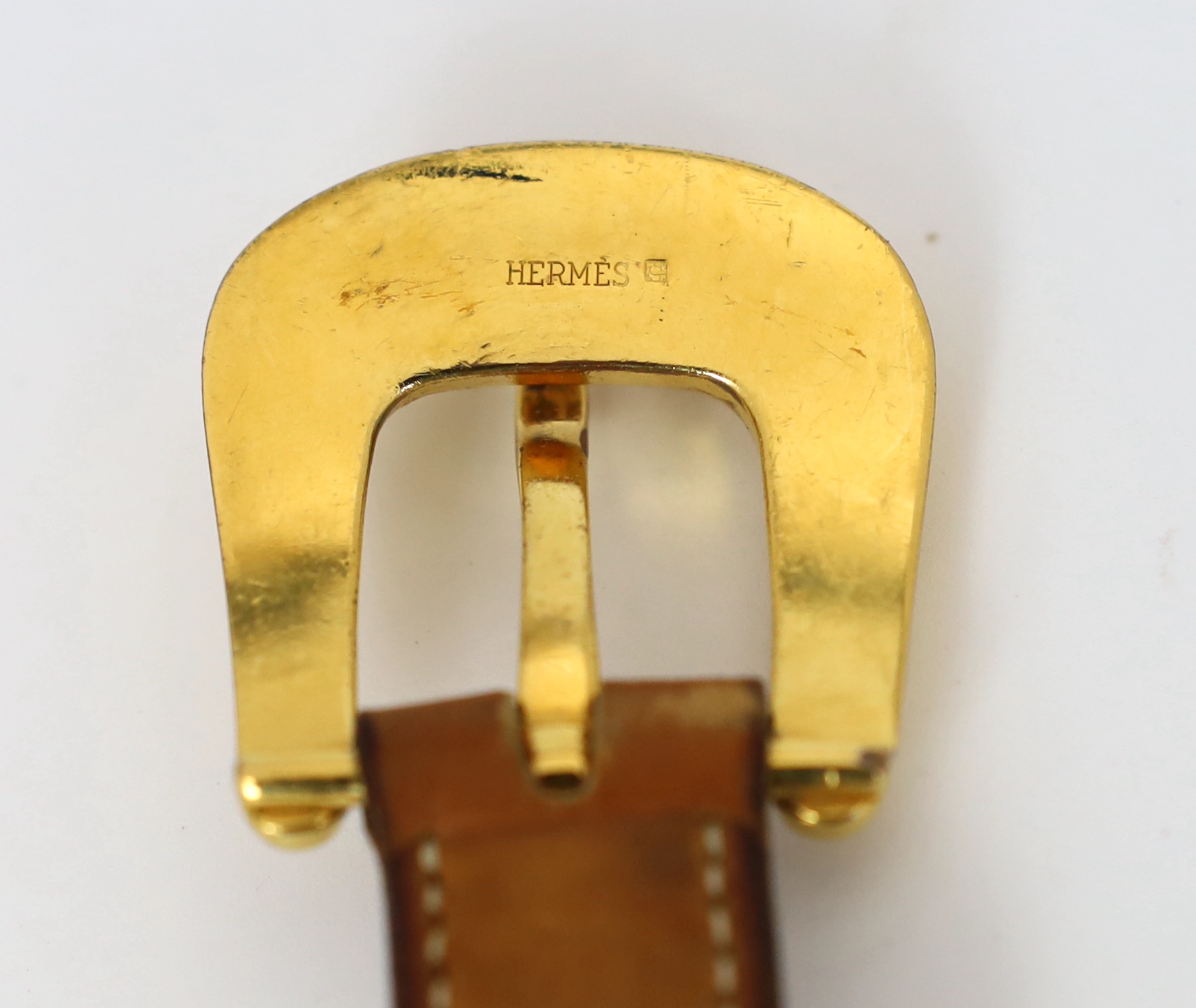 A Hermès lady's tan leather belt, size XS/Small